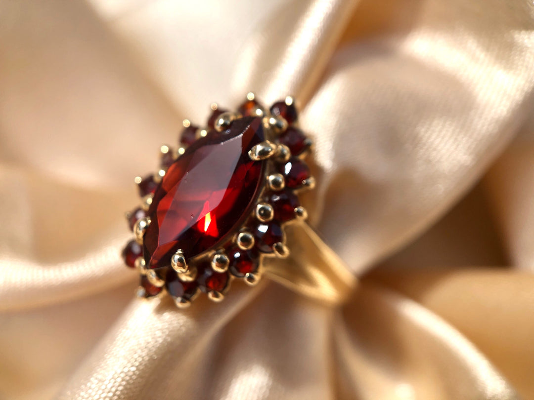 Autumn Glow Garnet Marquise Halo Ring in Solid Yellow Gold