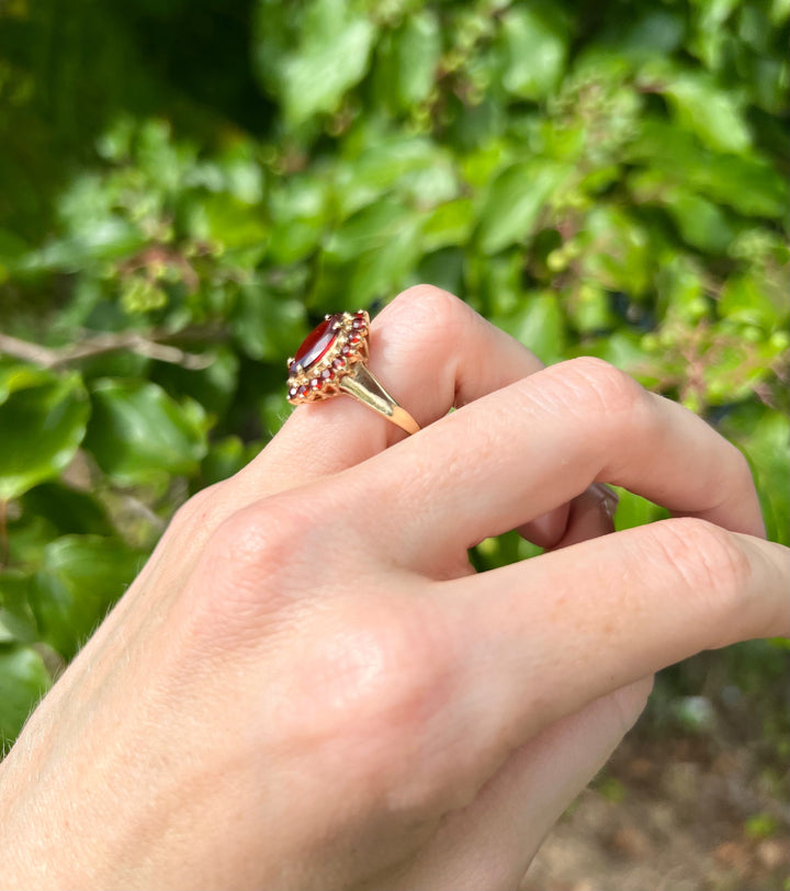 Autumn Glow Garnet Marquise Halo Ring in Solid Yellow Gold